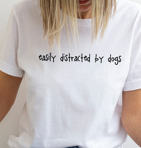 white t shirt easily distracted by dogs